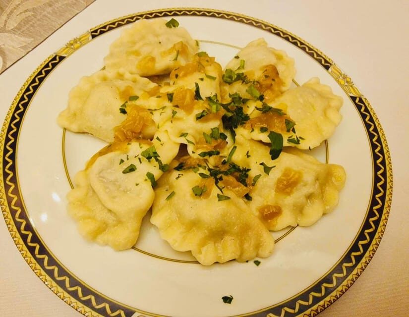 Taste of Poland, food tour and guided walk with 12 tasting - Starting at the Zachwatowicz monument: where your walk begins
